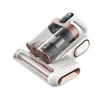 Handheld vacuum cleaner with rose gold accents on a white background